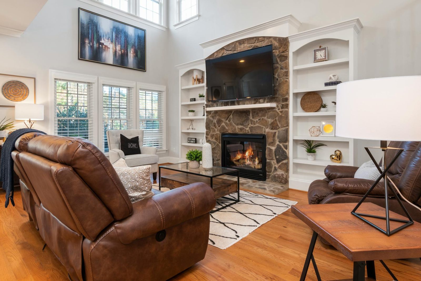 Cozy farmhouse living room with fireplace and warm lighting
